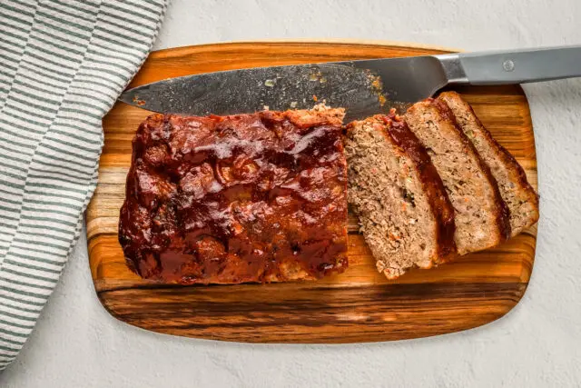 Korean meatloaf on a cutting board.