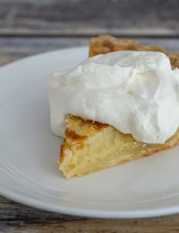 a lemon buttermilk pie with whipped cream