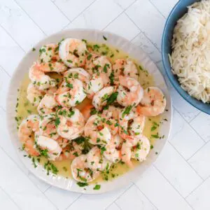 lemon and garlic shrimp with a bowl of rice on the side