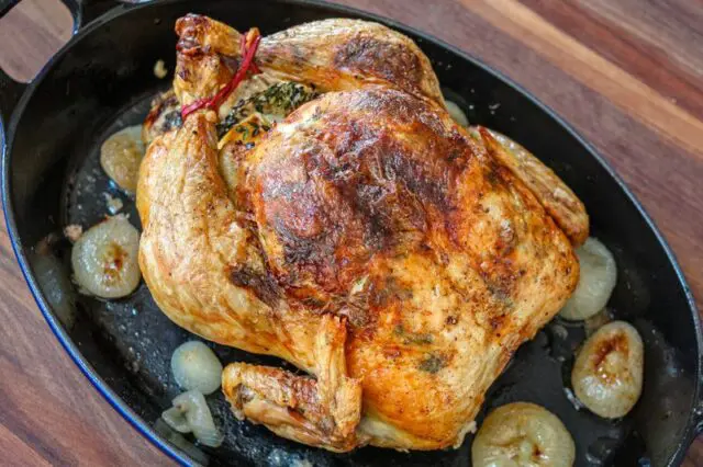 A perfectly roasted Sunday dinner chicken with lemon and herbs