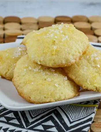 tea cakes on a plate with a lemon glaze and sparkling sugar