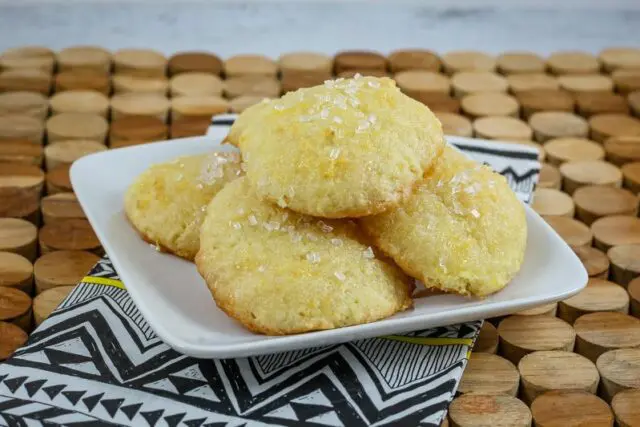 tea cakes on a plate with a lemon glaze and sparkling sugar