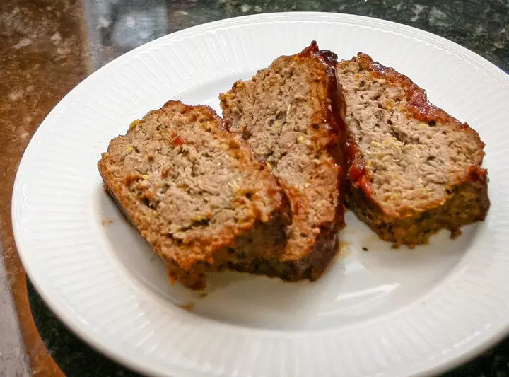 meatloaf with zucchini shown on a large plate