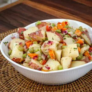 light potato salad in a serving bowl