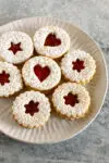 Linzer cookies on a plate.