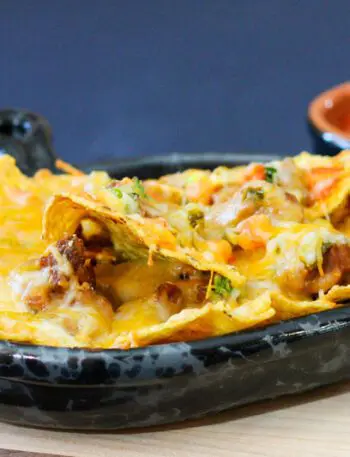 loaded nachos in a luncheon plate