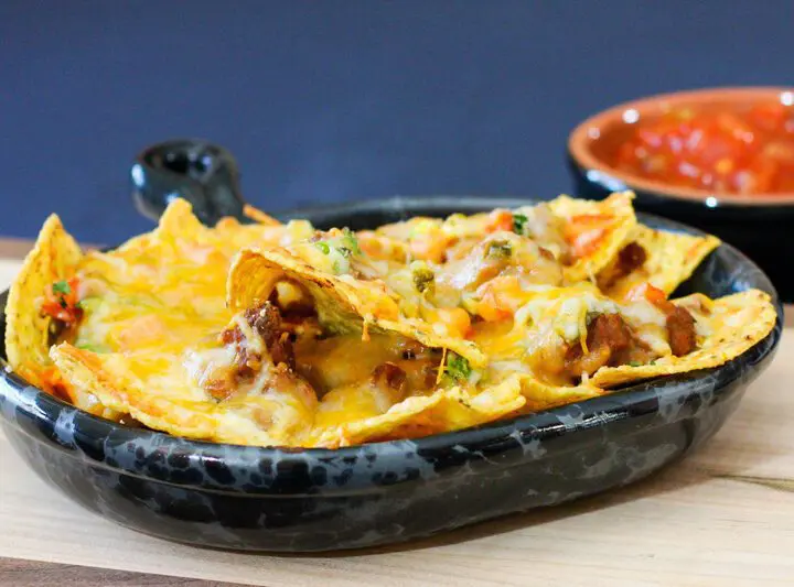 loaded nachos in a luncheon plate