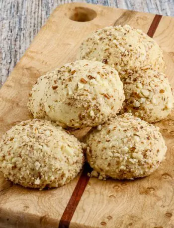 macadamia nut cookies on a small cutting board