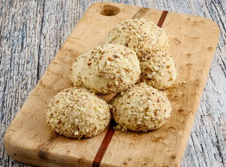 macadamia nut cookies on a small cutting board