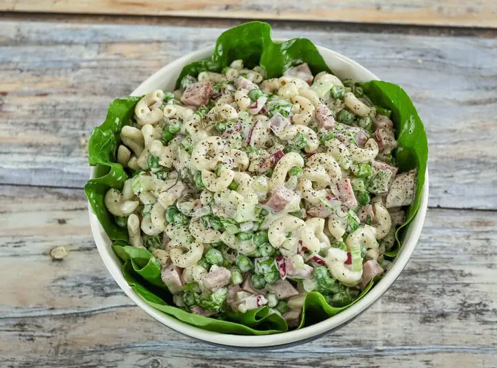 macaroni salad with ham in a serving bowl