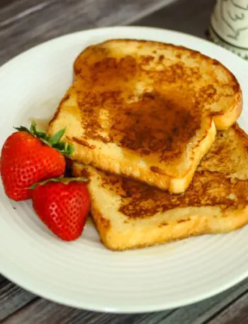 maple cinnamon french toast on a plate with strawberries