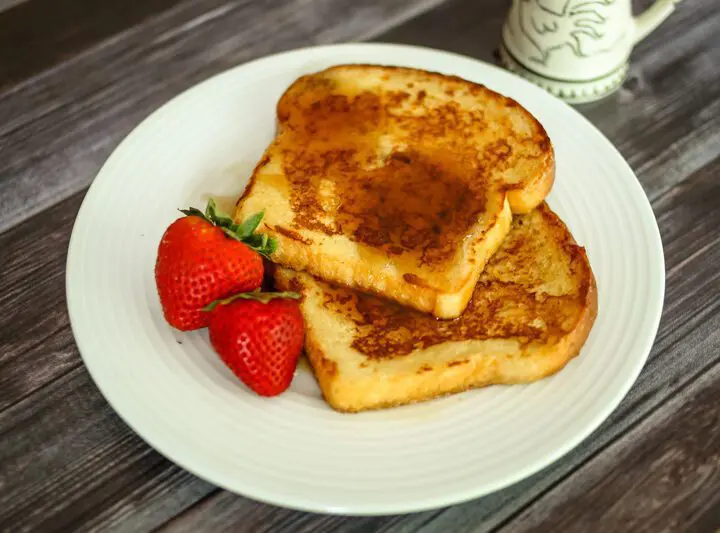 maple cinnamon french toast on a plate with strawberries