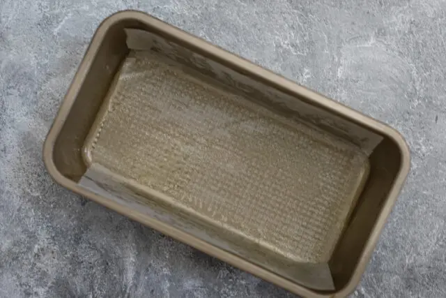 Marble pound cake preparation: Lining the loaf pan.