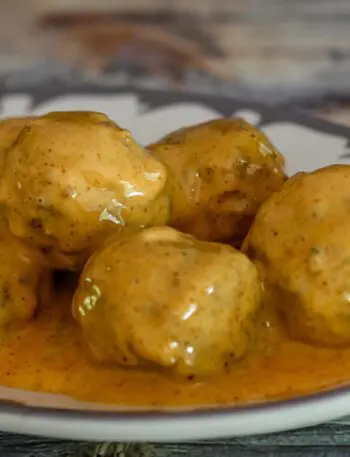 spicy tex-mex meatballs with cheese sauce on a plate