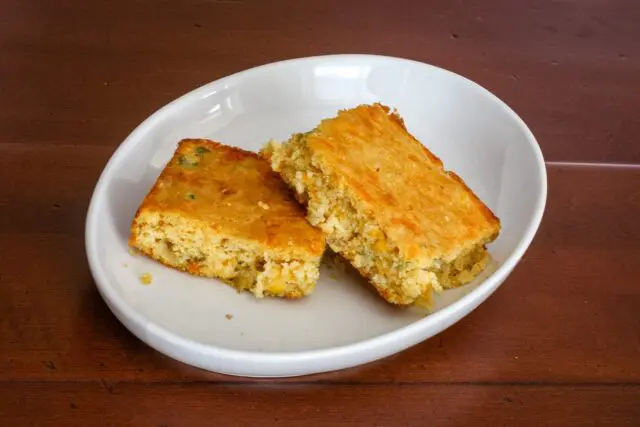 2 slices of mexican cornbread in a dish