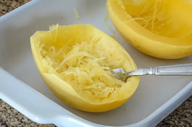 Closeup of cooked microwave spaghetti squash in the baking dish.