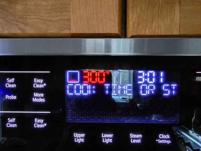 Set the oven timer to 300 F to bake the million dollar pound cake.