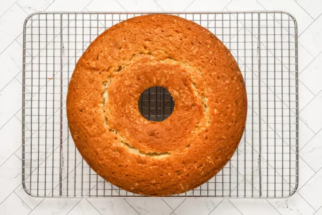 Baked million dollar pound cake on the cooling rack.