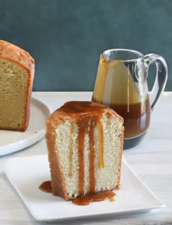 A slice of million dollar pound cake, a buttermilk pound cake with a caramel sauce drizzle.