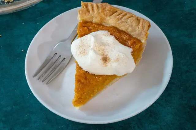 An overhead photo of a slice of sweet potato pie.