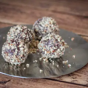 Easy nut-coated chocolate truffles on a plate.