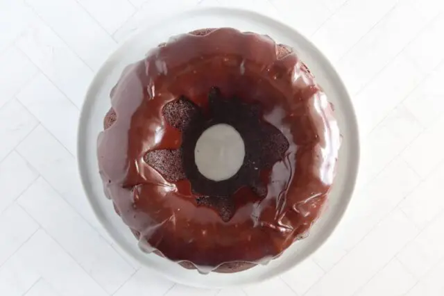 Glazing the chocolate Bundt cake.