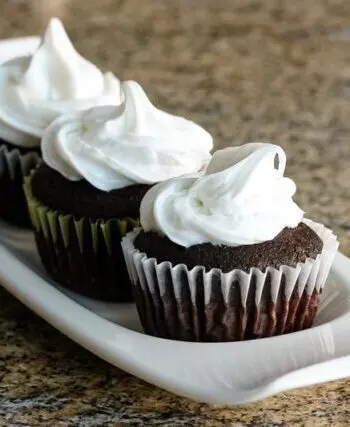 Moist chocolate cupcakes on a serving tray.