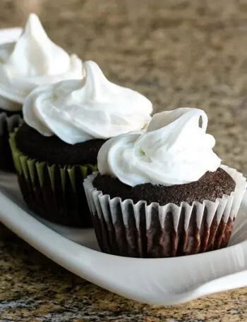 Moist chocolate cupcakes on a serving tray.