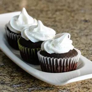 Moist chocolate cupcakes on a serving tray.