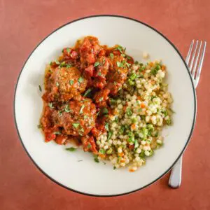 A plate of moroccan meatballs with couscous