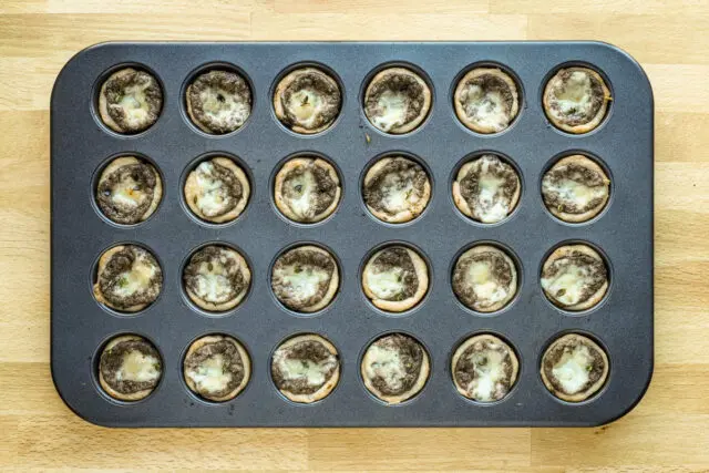 Baked mushroom tartlets with fontina cheese.