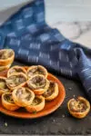 Tartlets with cream cheese pastry filled with mushroom duxelles and fontina cheese.