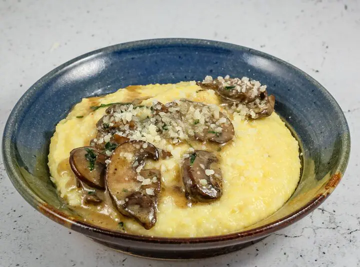 Sautéed mushrooms with butter and white wine over polenta.