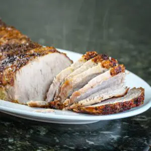 mustard glazed pork loin roast on a platter