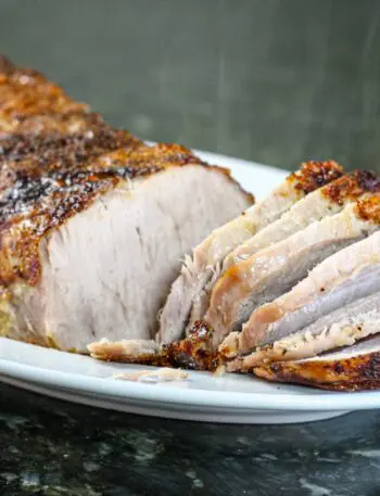 sweet mustard glazed pork loin on a platter.