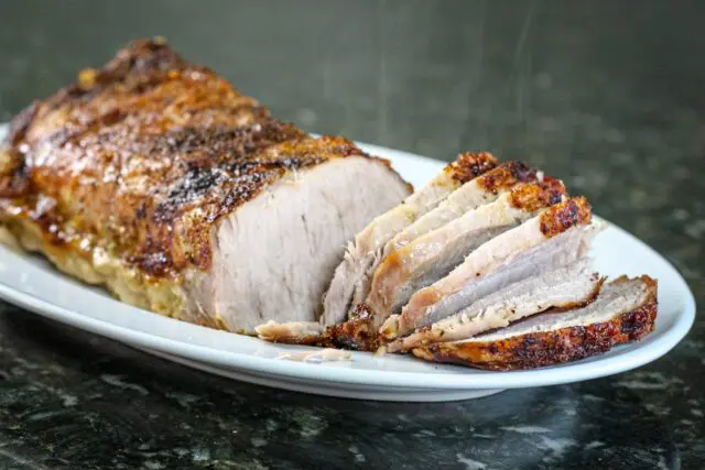 sweet mustard glazed pork loin on a platter.