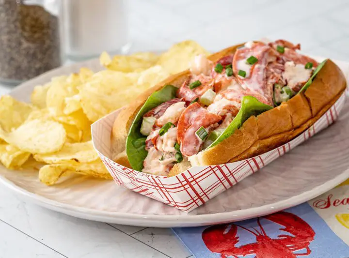 An authentic New England lobster roll in a New England hot dog roll.