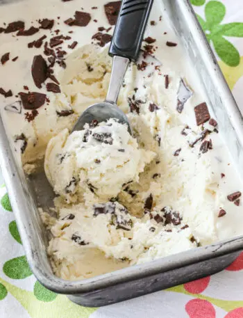 Easy no churn ice cream in a loaf pan with scoop.