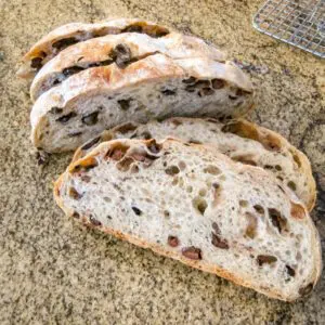 Sliced no knead olive bread with kalamata olives.