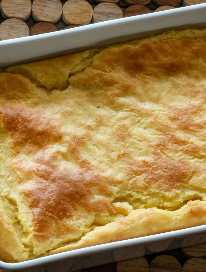 A baking dish with old-fashioned spoonbread, baked