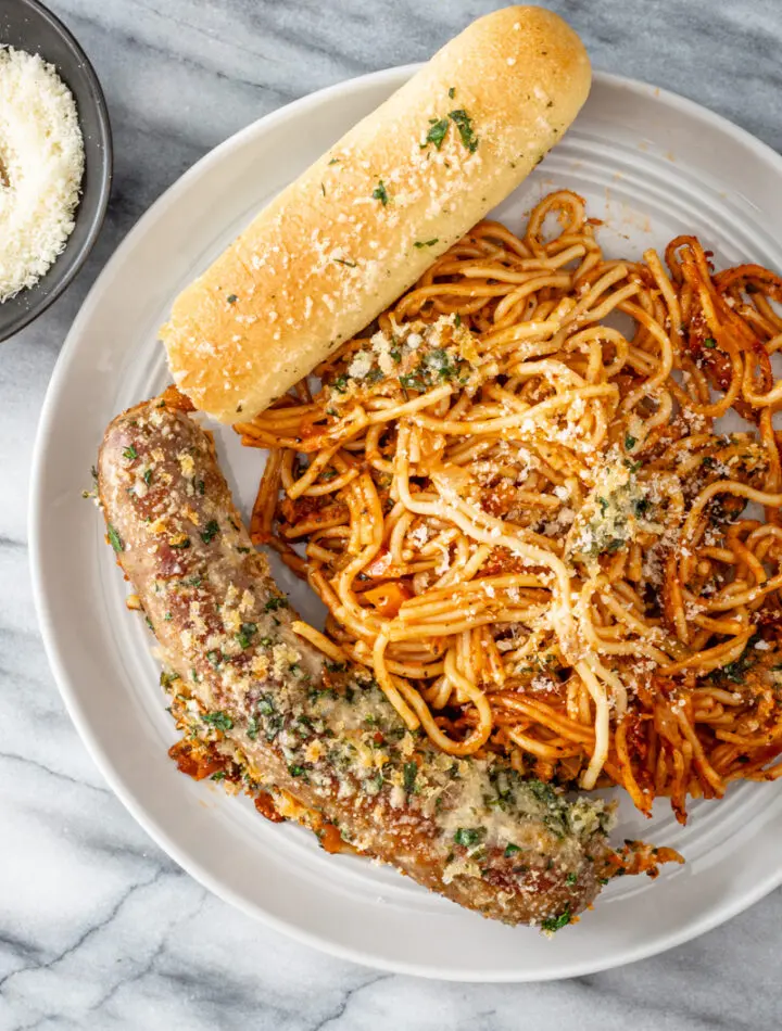 A plate of crispy one pot spaghetti and sausage dinner.