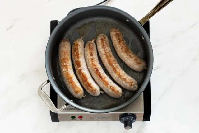 Browning the Italian sausages for the spaghetti dinner.