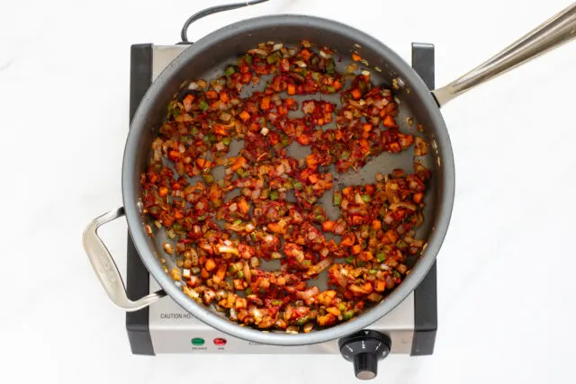 Cooking the aromatics for the spaghetti and sausage dinner.