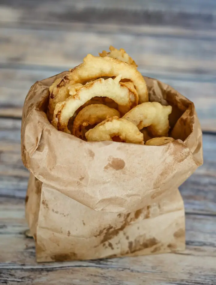 onion rings in a paper bag