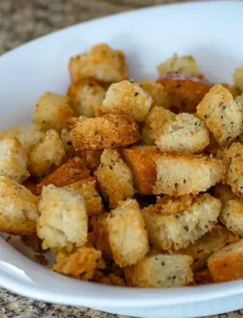 Seasoned croutons in a small bowl.