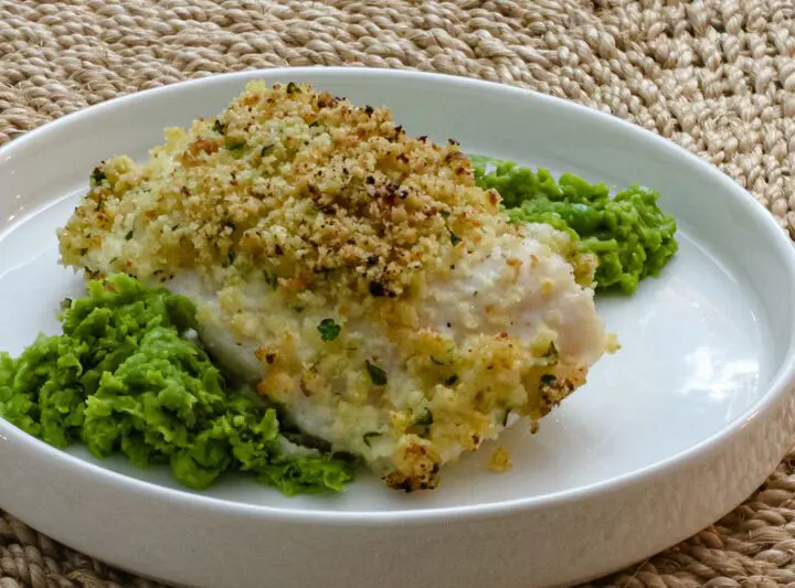 pea puree on a platewith a halibut filet