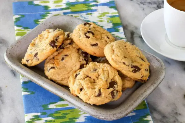 A small tray with baked peanut butter chocolate chip cookies.