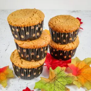 A stack of peanut butter cupcakes, unfrosted.