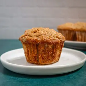 A pear muffin on a small plate