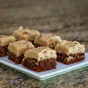 brownies with penuche frosting on a plate